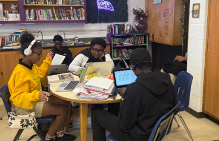  Students sitting at a table working